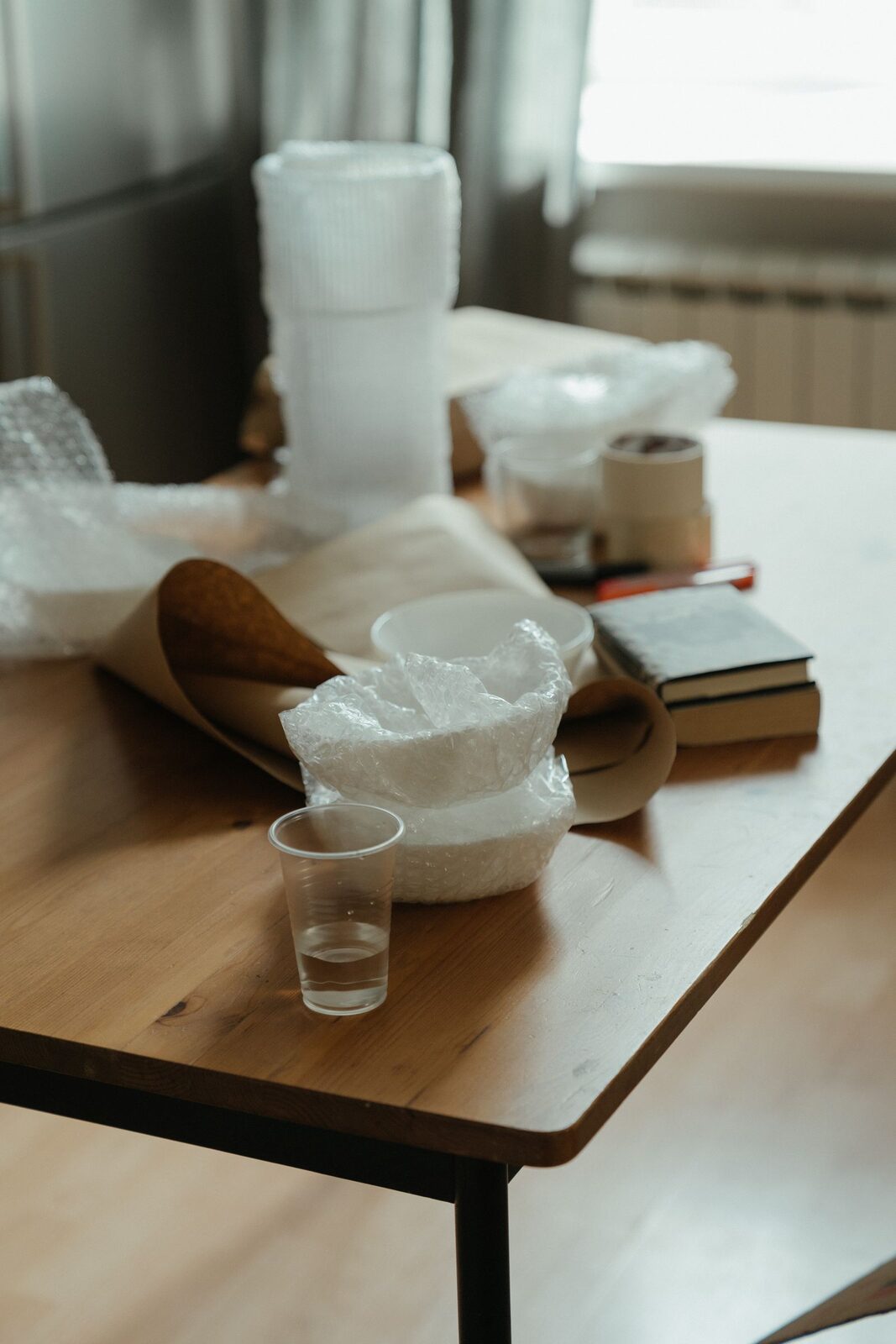 Wrapping fragile items with bubble wrap for a move
